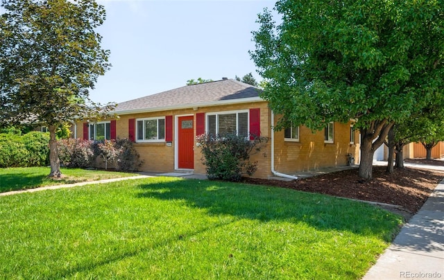 2900 Krameria St, Denver, CO 80207 - ranch-style house with brick siding, a front lawn, and roof with shingles