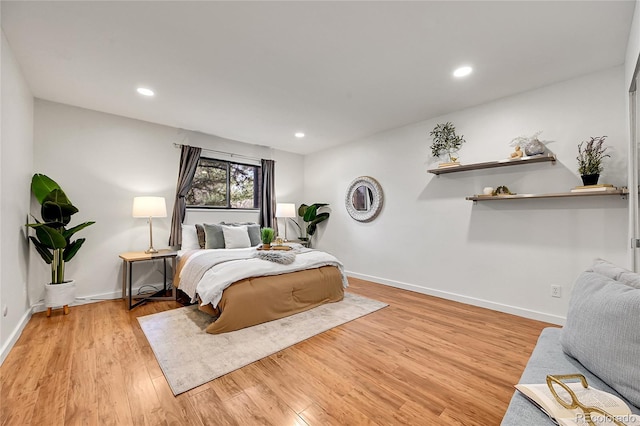 201 Wright St Unit 105, Lakewood, CO 80228 - bedroom with light wood-type flooring, baseboards, and recessed lighting