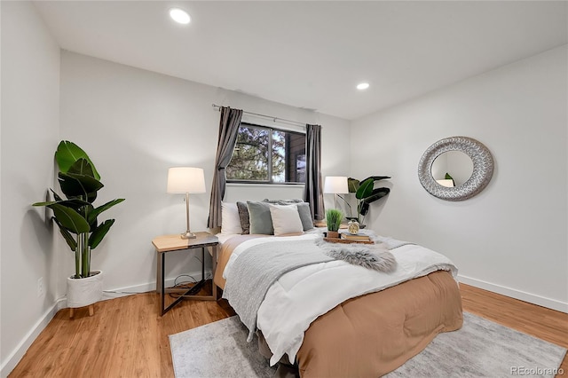 201 Wright St Unit 105, Lakewood, CO 80228 - bedroom with baseboards, light wood-style floors, and recessed lighting