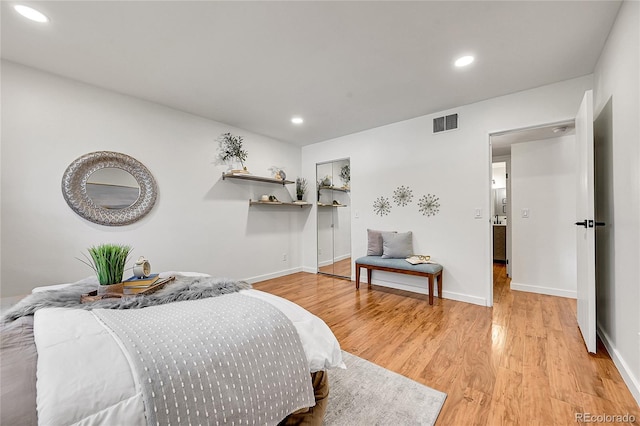201 Wright St Unit 105, Lakewood, CO 80228 - bedroom with light wood-type flooring, baseboards, and recessed lighting