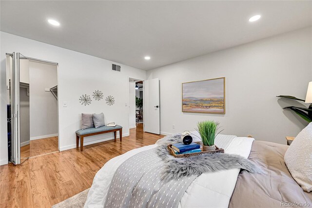 201 Wright St Unit 105, Lakewood, CO 80228 - bedroom with wood finished floors, recessed lighting, baseboards, and a spacious closet