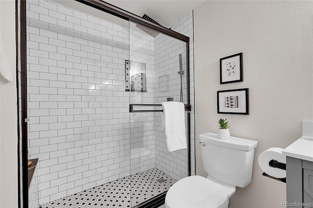 201 Wright St Unit 105, Lakewood, CO 80228 - full bathroom with vanity, toilet, and a shower stall
