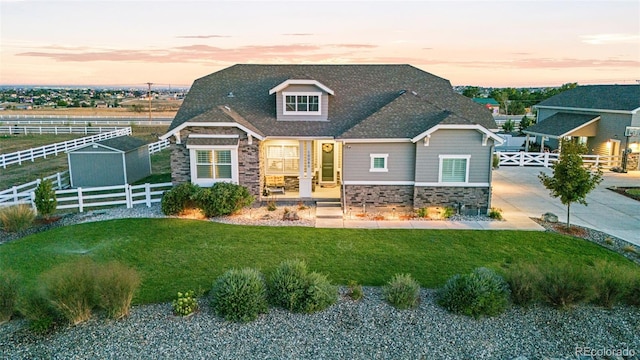 10080 E 160th Pl, Brighton, CO 80602 - view of front of property with stone siding and a shingled roof