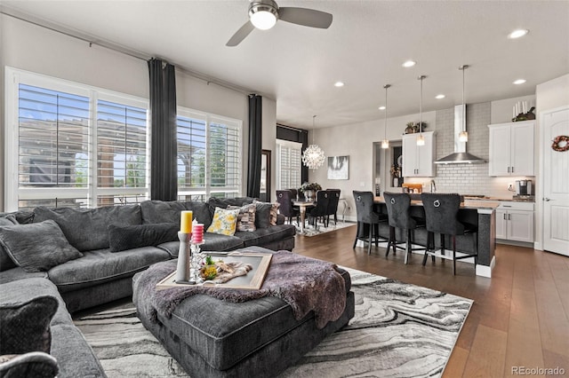 10080 E 160th Pl, Brighton, CO 80602 - living room with ceiling fan, recessed lighting, dark wood-style flooring, and a chandelier