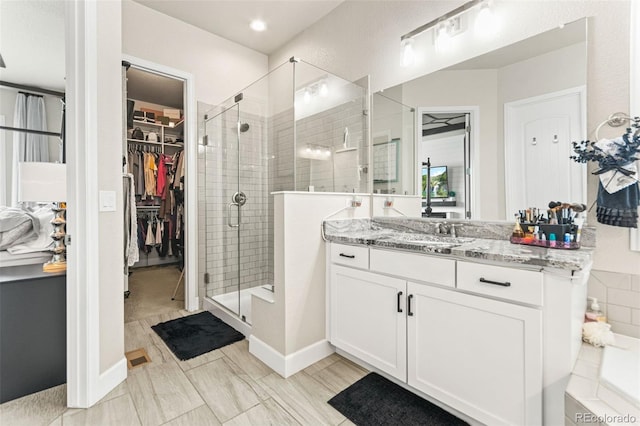 10080 E 160th Pl, Brighton, CO 80602 - full bath featuring a stall shower, vanity, and a spacious closet