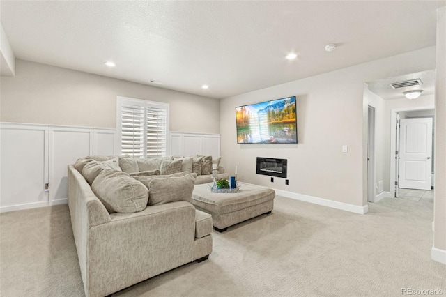 10080 E 160th Pl, Brighton, CO 80602 - living area with light carpet, recessed lighting, and a wainscoted wall