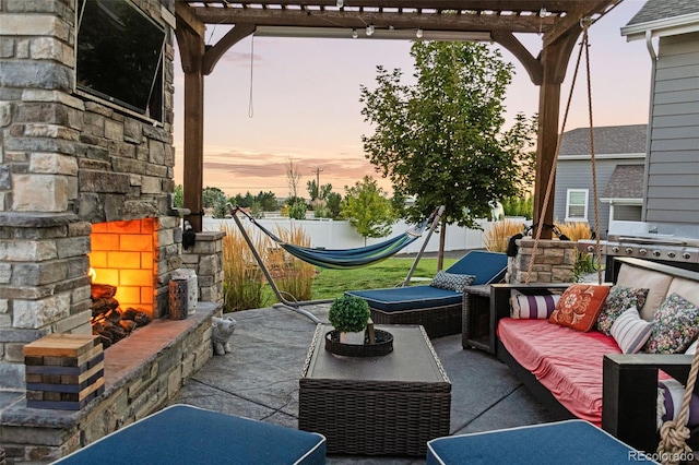 10080 E 160th Pl, Brighton, CO 80602 - view of patio / terrace with an outdoor living space with a fireplace and a pergola