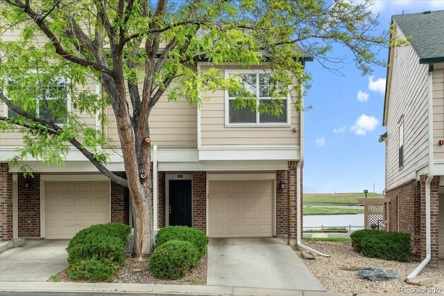 1631 Egret Way, Superior, CO 80027 - view of front of home with brick siding, driveway, and an attached garage