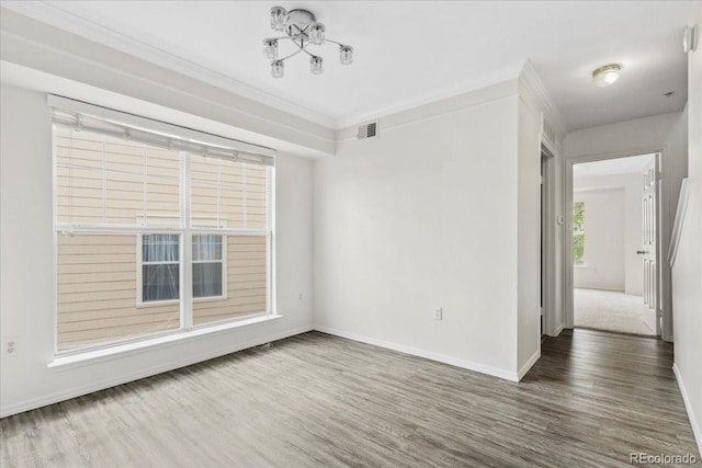 1631 Egret Way, Superior, CO 80027 - spare room featuring wood finished floors, baseboards, and ornamental molding