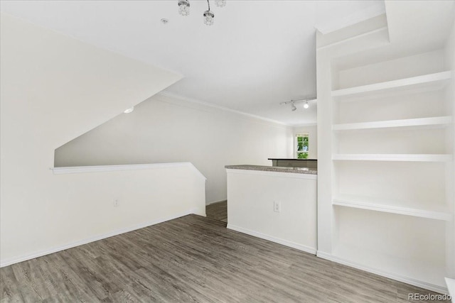 1631 Egret Way, Superior, CO 80027 - bar featuring wood finished floors, crown molding, and rail lighting