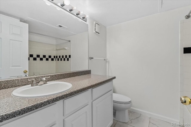 1631 Egret Way, Superior, CO 80027 - full bath with vanity, marble finish flooring, toilet, a tile shower, and baseboards
