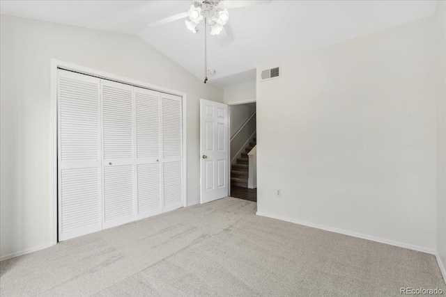 1631 Egret Way, Superior, CO 80027 - unfurnished bedroom with carpet floors, vaulted ceiling, a closet, baseboards, and a ceiling fan