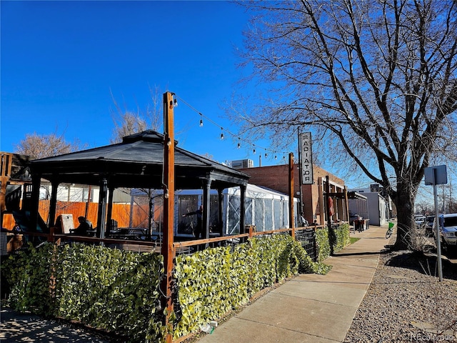 view of property exterior featuring a gazebo