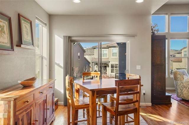 dining space with light wood-type flooring