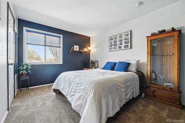7314 W Walker Pl, Littleton, CO 80123 - carpeted bedroom with a textured ceiling and baseboards