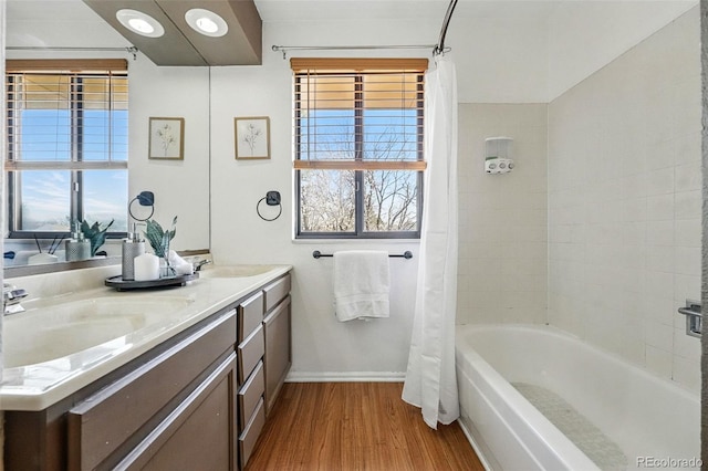 7314 W Walker Pl, Littleton, CO 80123 - full bath featuring a sink, a wealth of natural light, and wood finished floors
