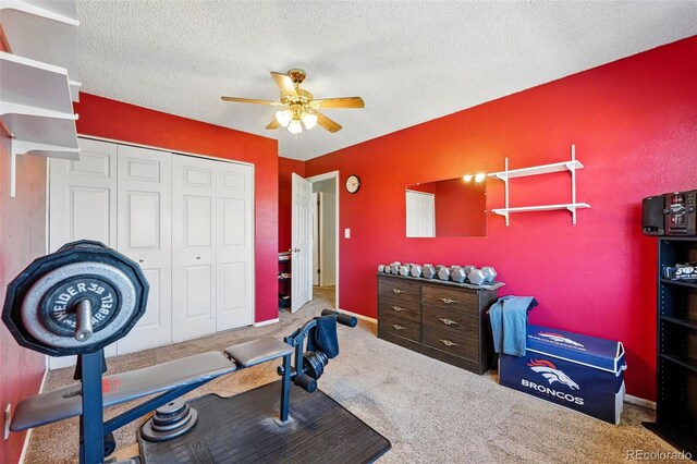 7314 W Walker Pl, Littleton, CO 80123 - workout area featuring ceiling fan, carpet, and a textured ceiling