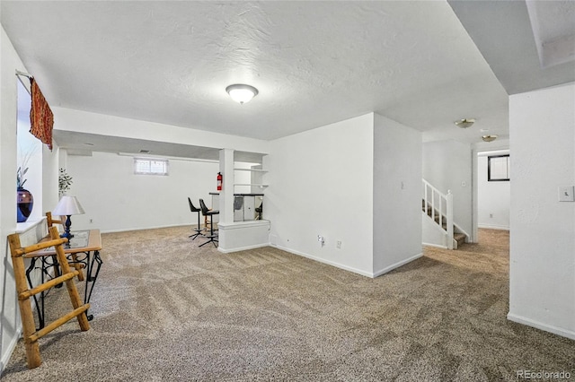 7314 W Walker Pl, Littleton, CO 80123 - interior space with a textured ceiling, baseboards, stairway, and carpet floors