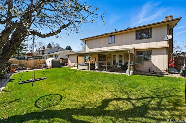 7314 W Walker Pl, Littleton, CO 80123 - back of house featuring a patio, an outdoor structure, a chimney, a shed, and a fenced backyard