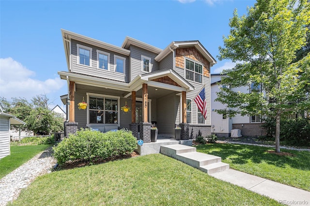 4180 Ames St, Denver, CO 80212 - view of front of home with a porch and a front lawn