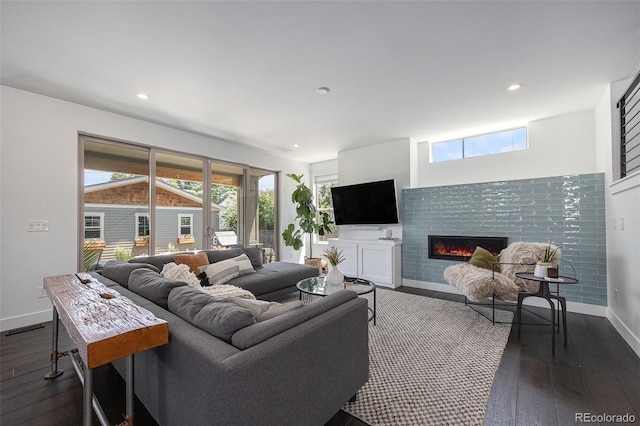 4180 Ames St, Denver, CO 80212 - living room with dark wood-type flooring, a glass covered fireplace, and recessed lighting