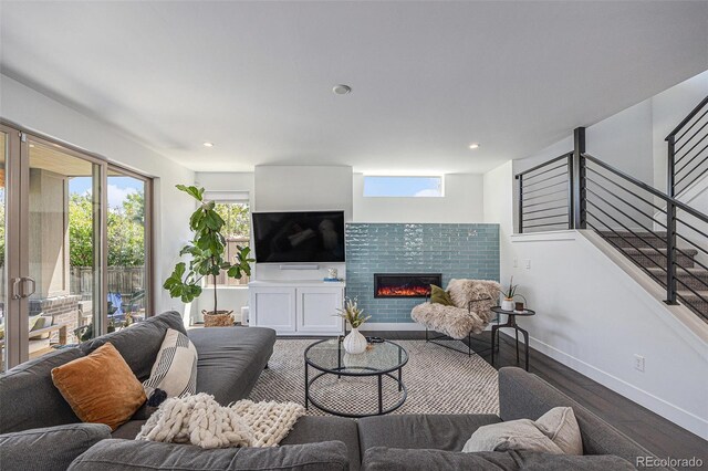 4180 Ames St, Denver, CO 80212 - living room with wood finished floors, a tile fireplace, stairs, and recessed lighting