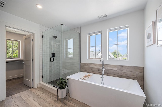 4180 Ames St, Denver, CO 80212 - full bath featuring a stall shower, wood tiled floors, a freestanding tub, and recessed lighting