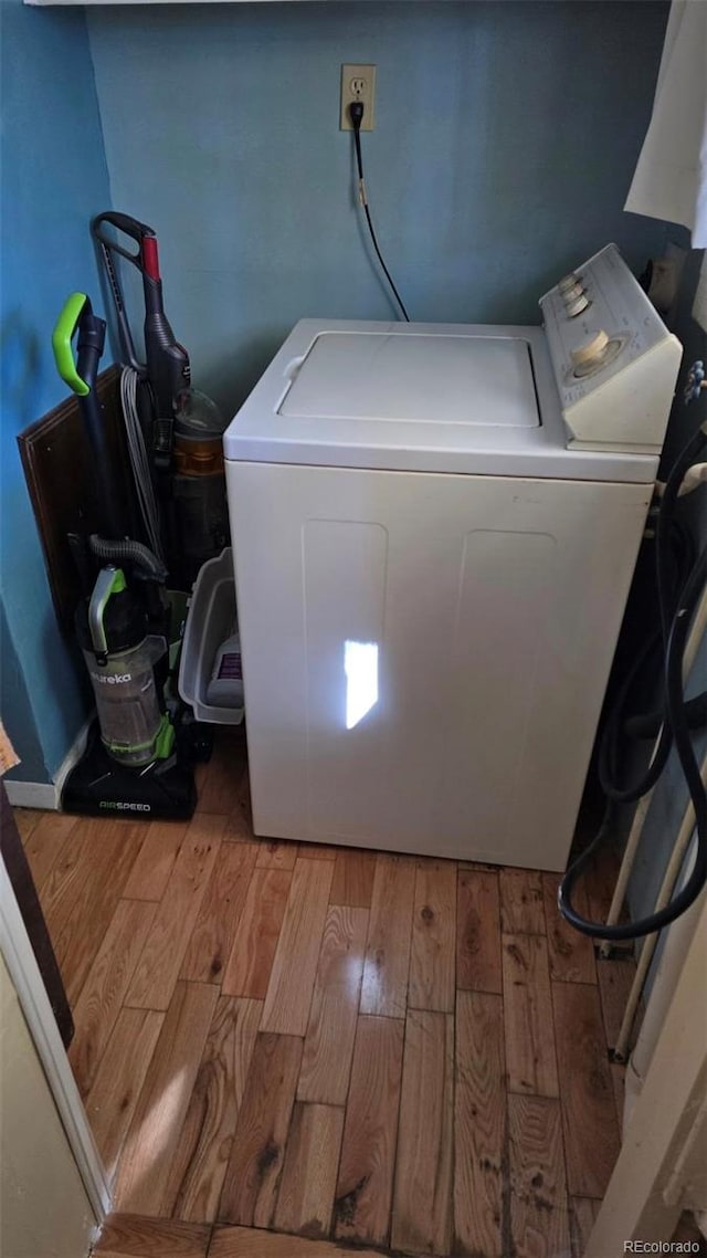 1010 San Juan Ave, Saguache, CO 81149 - laundry room featuring washer / clothes dryer and wood finished floors