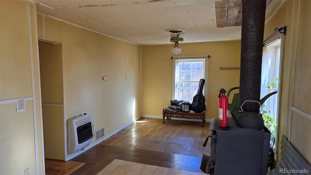 1010 San Juan Ave, Saguache, CO 81149 - sitting room with heating unit and hardwood / wood-style flooring