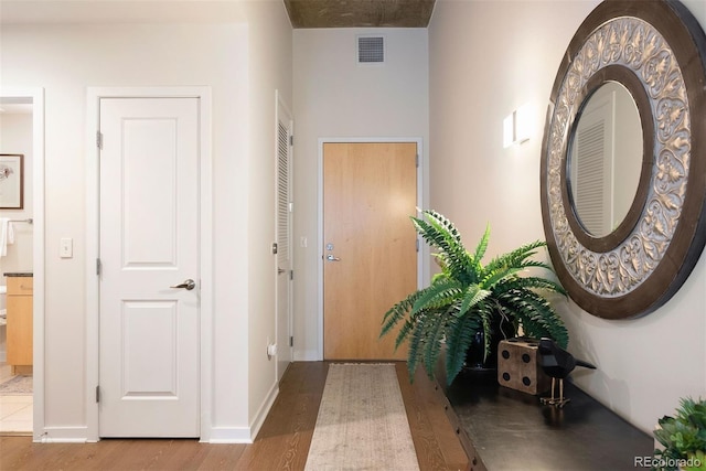 corridor with wood-type flooring