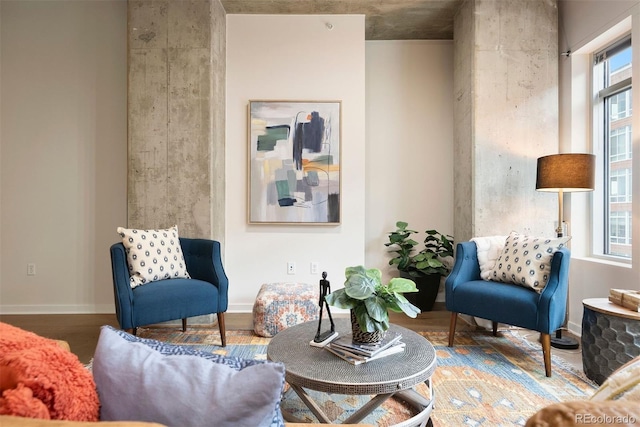 living area featuring plenty of natural light and hardwood / wood-style floors