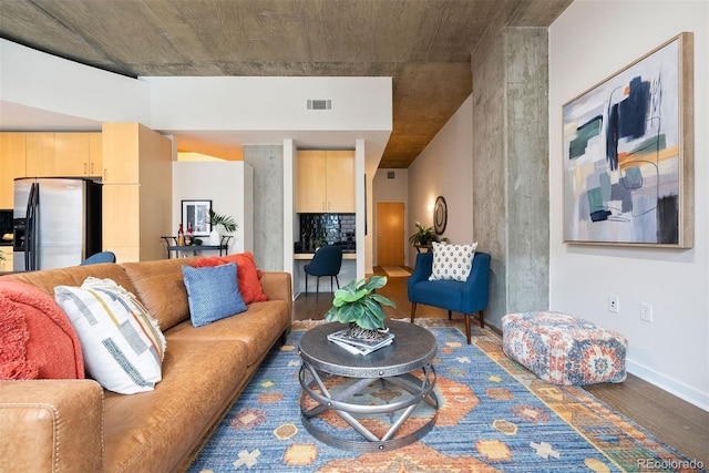 living room with dark hardwood / wood-style floors