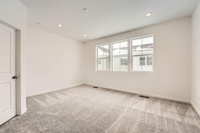 spare room featuring carpet floors