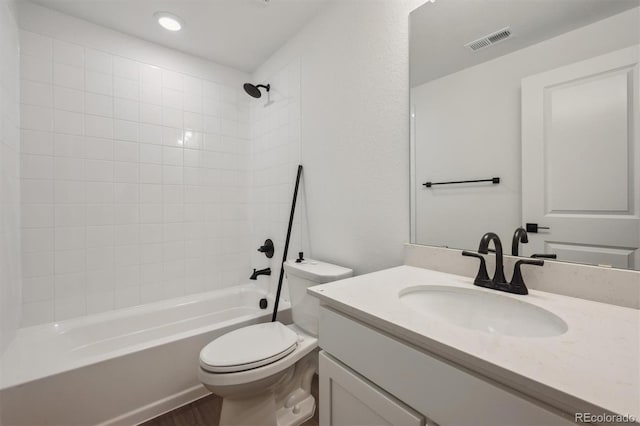 24708 E 40th Ave, Aurora, CO 80019 - bathroom featuring toilet, bathing tub / shower combination, vanity, wood finished floors, and recessed lighting