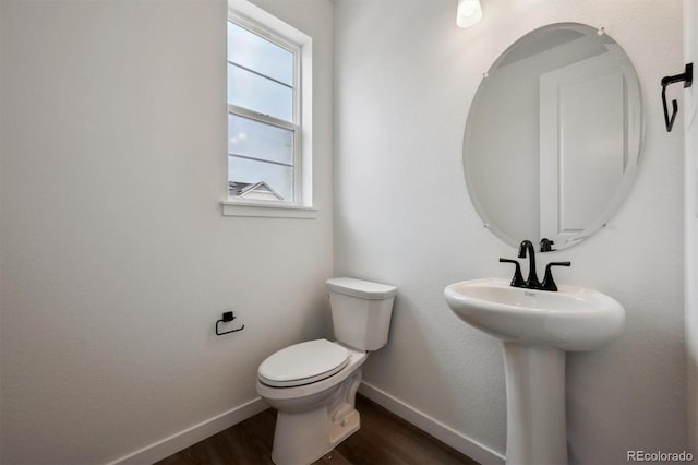 24708 E 40th Ave, Aurora, CO 80019 - half bathroom with baseboards, toilet, and wood finished floors
