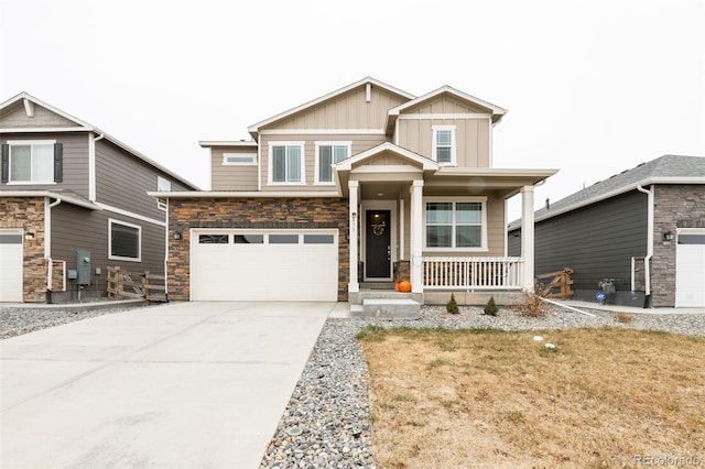 craftsman house featuring a garage, covered porch, and a front lawn