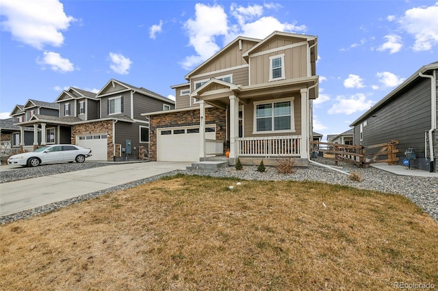 craftsman house with a porch, a front lawn, and a garage