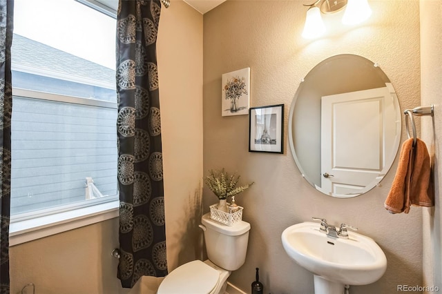 833 Vixen Dr, Fort Collins, CO 80524 - bathroom with toilet, a healthy amount of sunlight, and sink