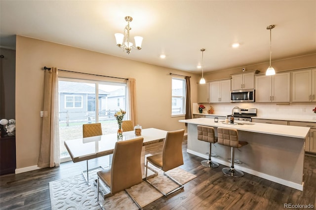 833 Vixen Dr, Fort Collins, CO 80524 - dining space featuring sink, dark hardwood / wood-style flooring, and a notable chandelier