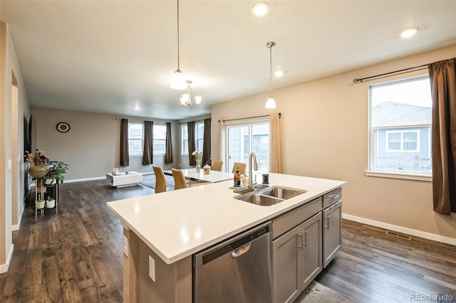 833 Vixen Dr, Fort Collins, CO 80524 - kitchen featuring dishwasher, a wealth of natural light, hanging light fixtures, a center island with sink, and sink
