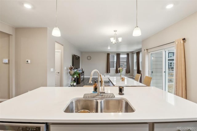833 Vixen Dr, Fort Collins, CO 80524 - kitchen featuring sink, dishwashing machine, pendant lighting, and an island with sink