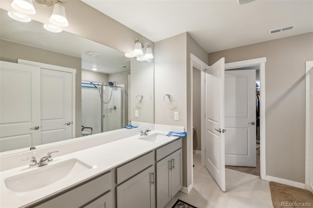 833 Vixen Dr, Fort Collins, CO 80524 - bathroom featuring vanity, an enclosed shower, and tile patterned flooring