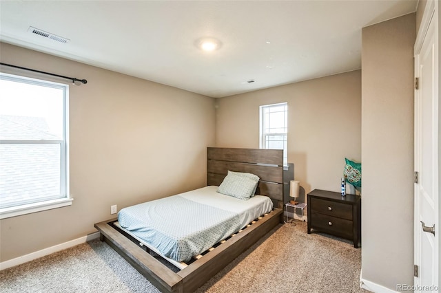 833 Vixen Dr, Fort Collins, CO 80524 - bedroom featuring multiple windows and light colored carpet