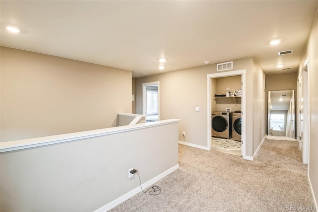 833 Vixen Dr, Fort Collins, CO 80524 - corridor with light colored carpet and washing machine and clothes dryer