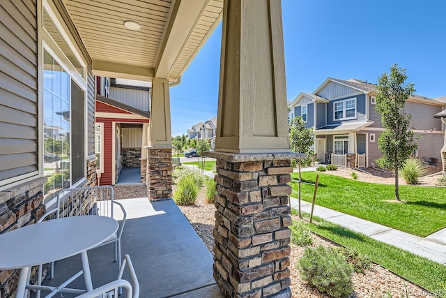 view of patio / terrace featuring a residential view and a porch