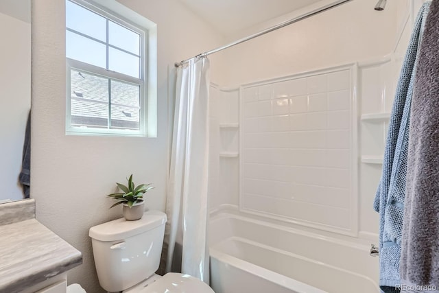 bathroom featuring toilet, shower / bath combo, and vanity