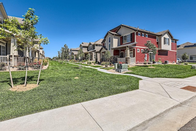 view of community with a residential view and a yard