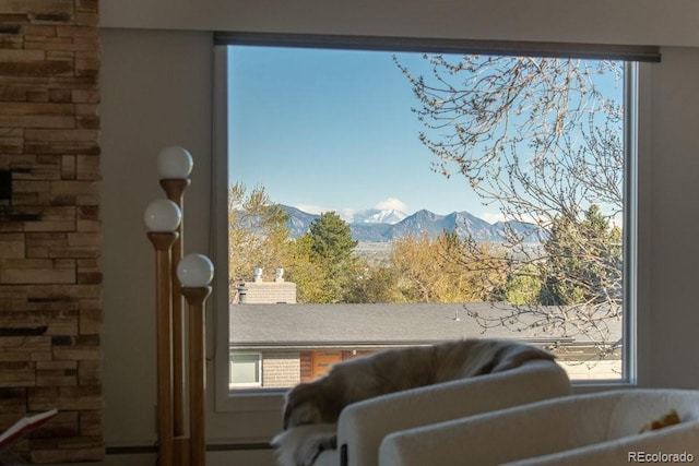 living area with a mountain view and a wealth of natural light