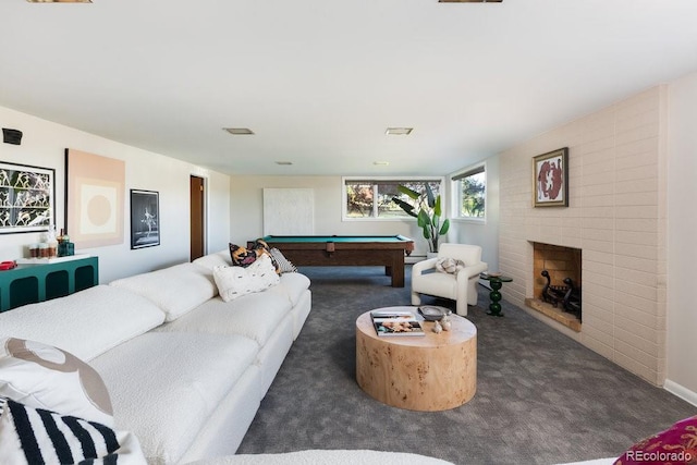 living room featuring carpet floors, pool table, visible vents, and a brick fireplace