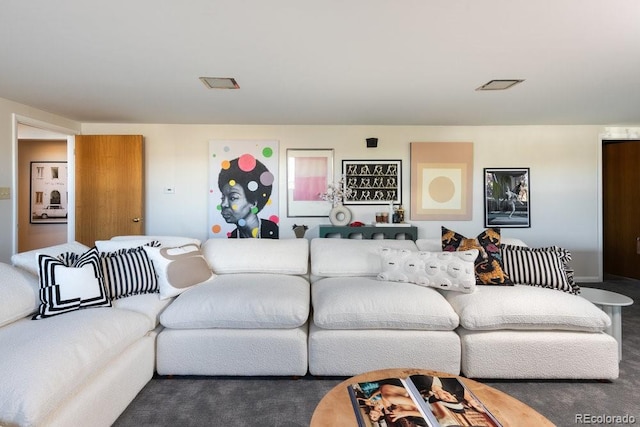 living room with visible vents and carpet